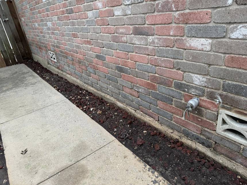After pressure washing: brick at grade