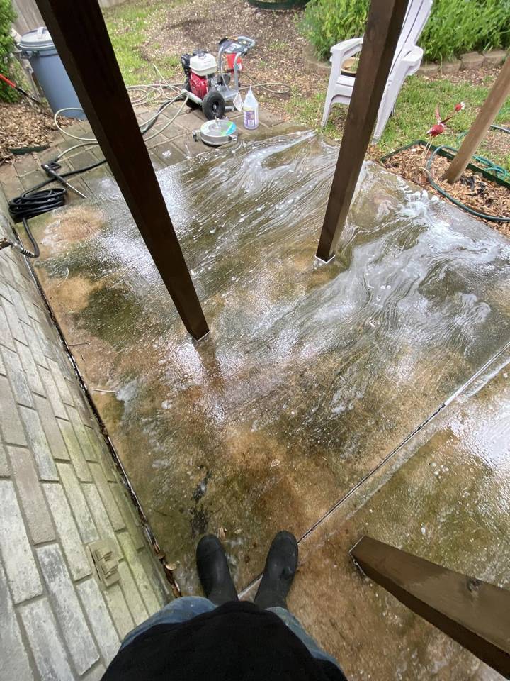 Before pressure washing: covered patio slab